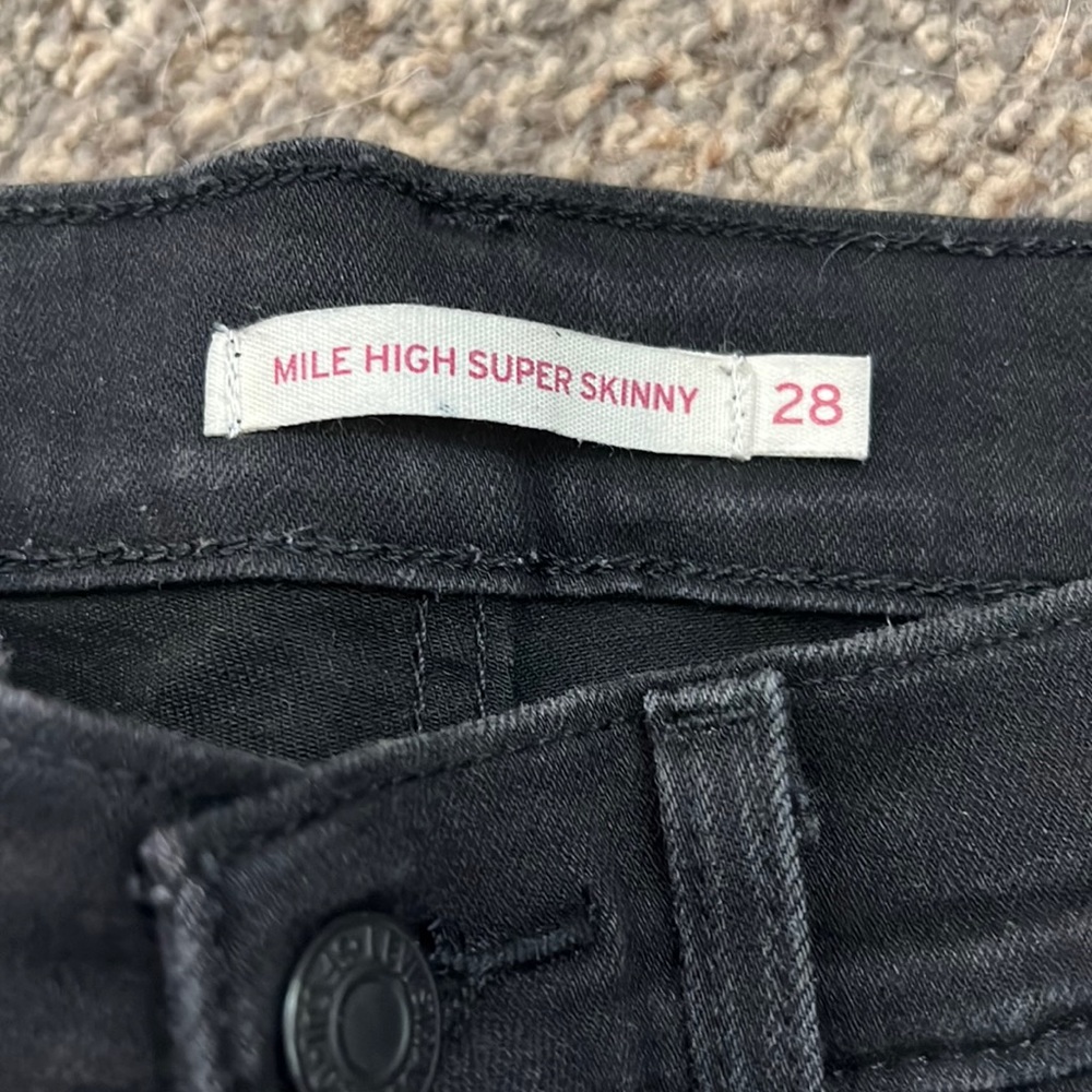 Mike high Levi’s ripped
